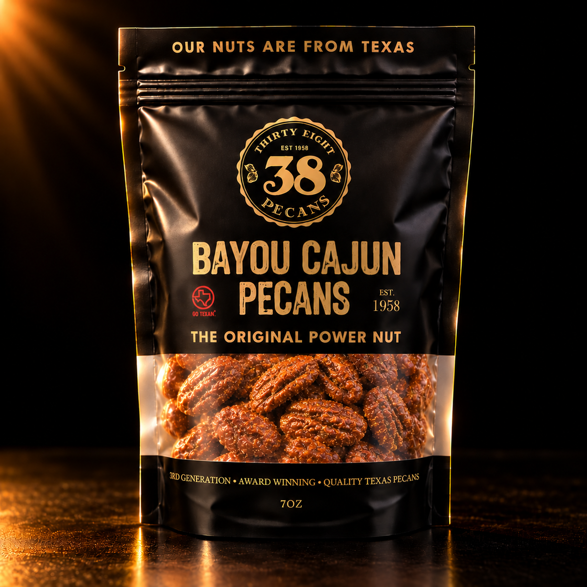 38 Pecans Bayou Cajun Pecans in a black and gold 7 oz resealable pouch, with savory Cajun-seasoned Texas pecan halves visible through the clear window.