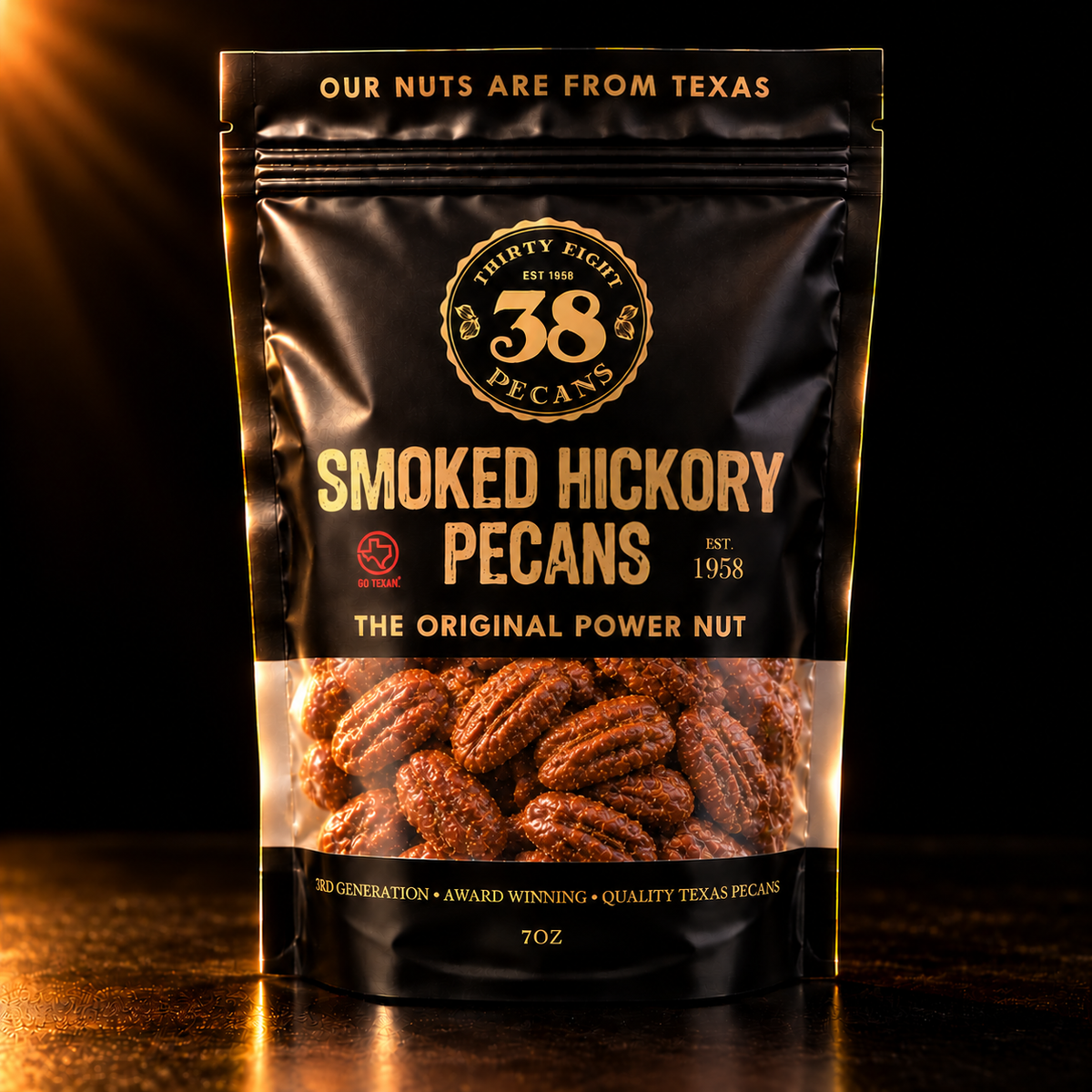 38 Pecans Smoked Hickory Pecans in a black and gold 7 oz resealable pouch, with savory hickory-smoked Texas pecan halves visible through the clear window.